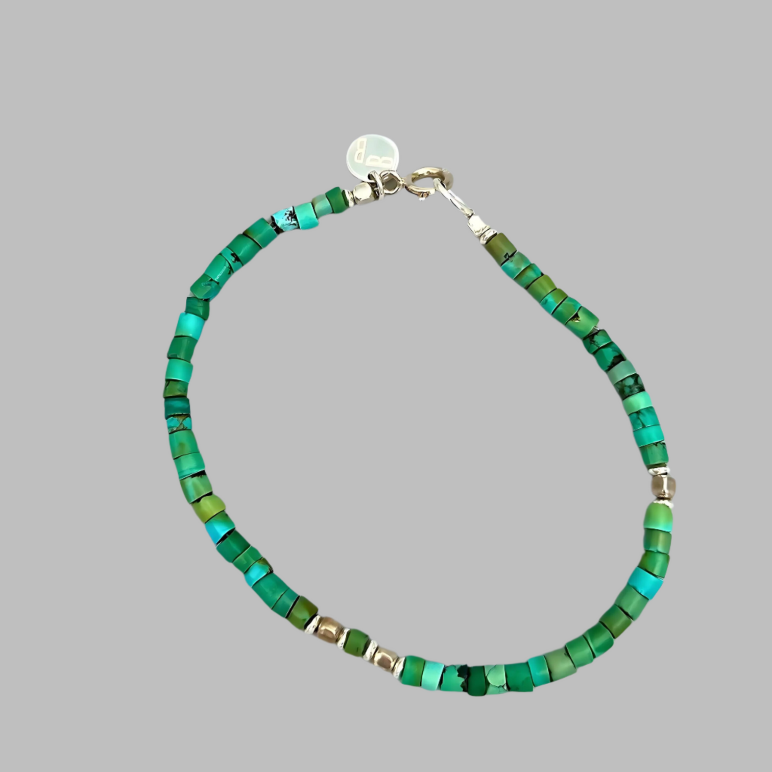 The Le BijouBijou Ocean Green Men's Bracelet is made with Blue-Green Turquoise and a touch of Sterling Silver.