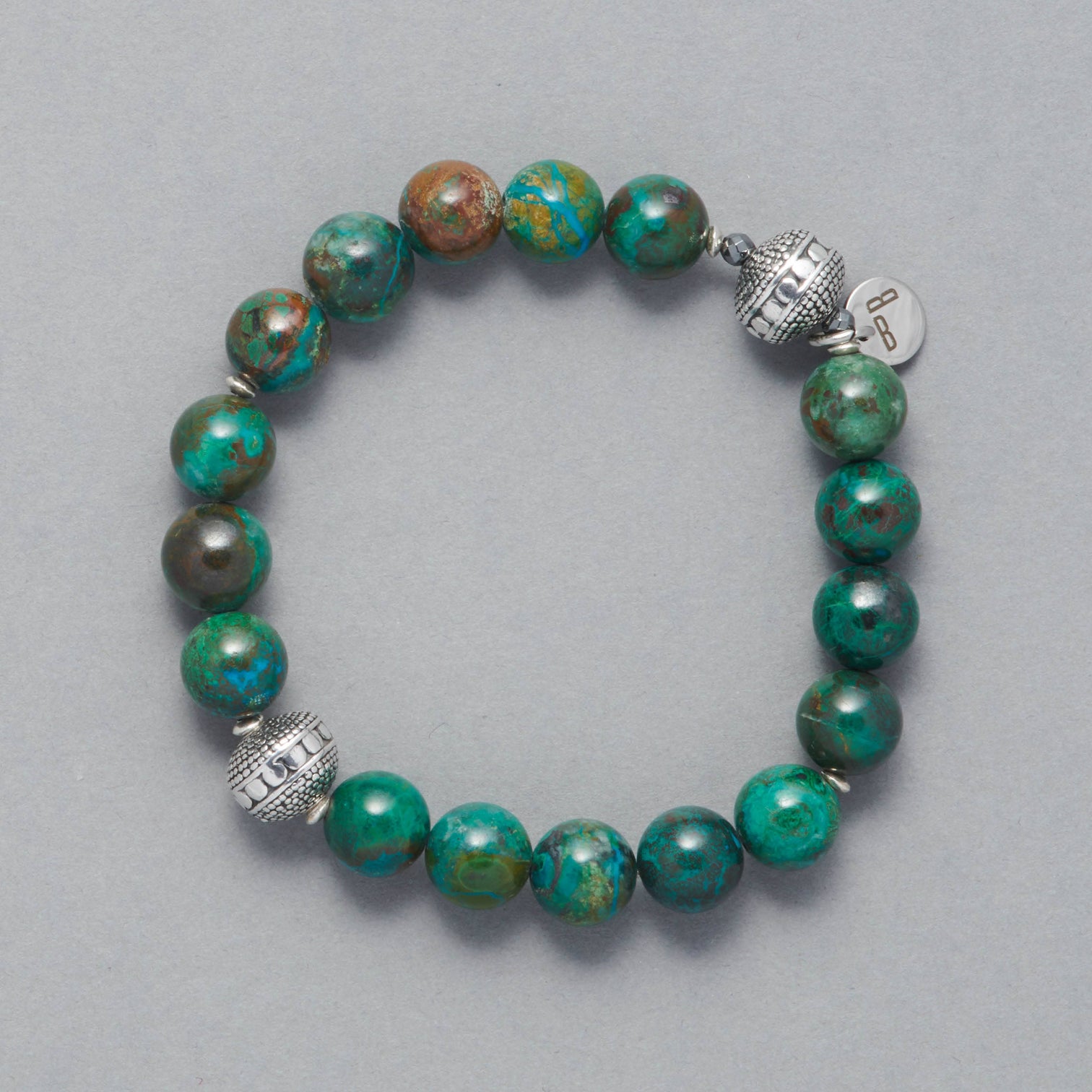 Product Shot of the Cyan Bracelet, made with Chrysocolla and two beautiful Sterling Silver Elements.