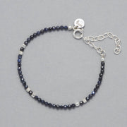 Product shot of the Indigo Anklet made with faceted Sapphires and square shaped Sterling Silver Beads.