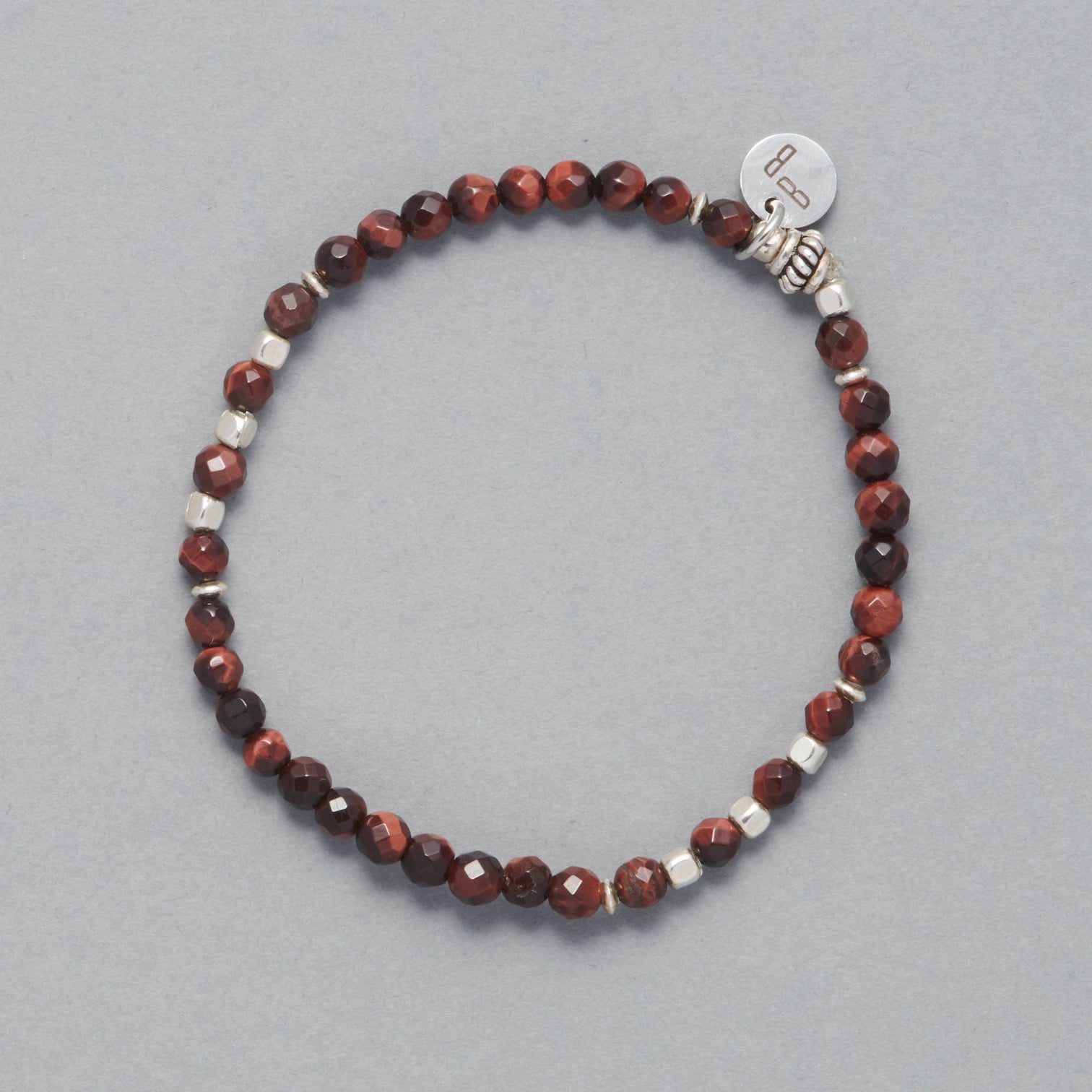 Product shot of the Kim Bracelet made with faceted red Tiger Eye and Sterling Silver Beads and Element.
