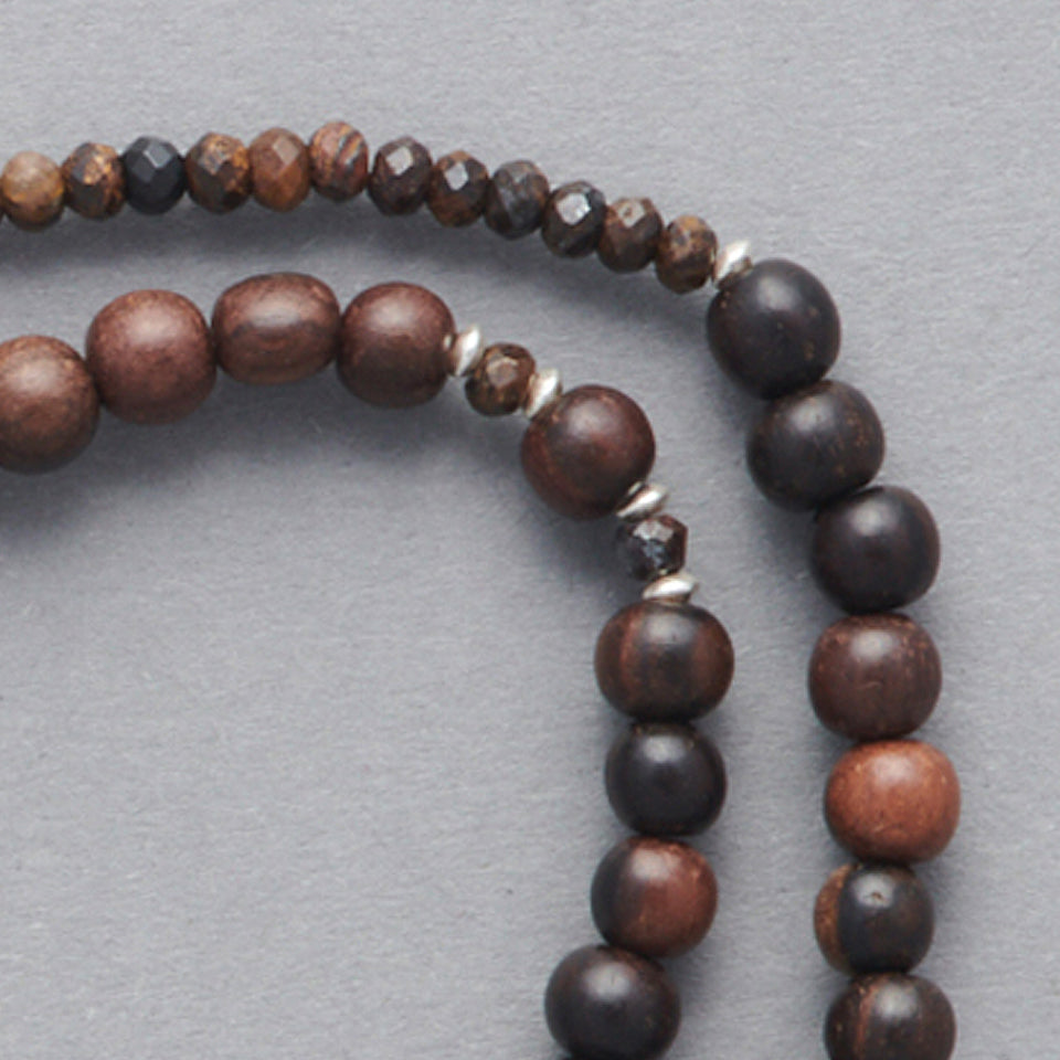 Product Close-up of the LE BIJOUBIJOU JOY Double Wrap Bracelet made with Ebony and Silver faceted stars.