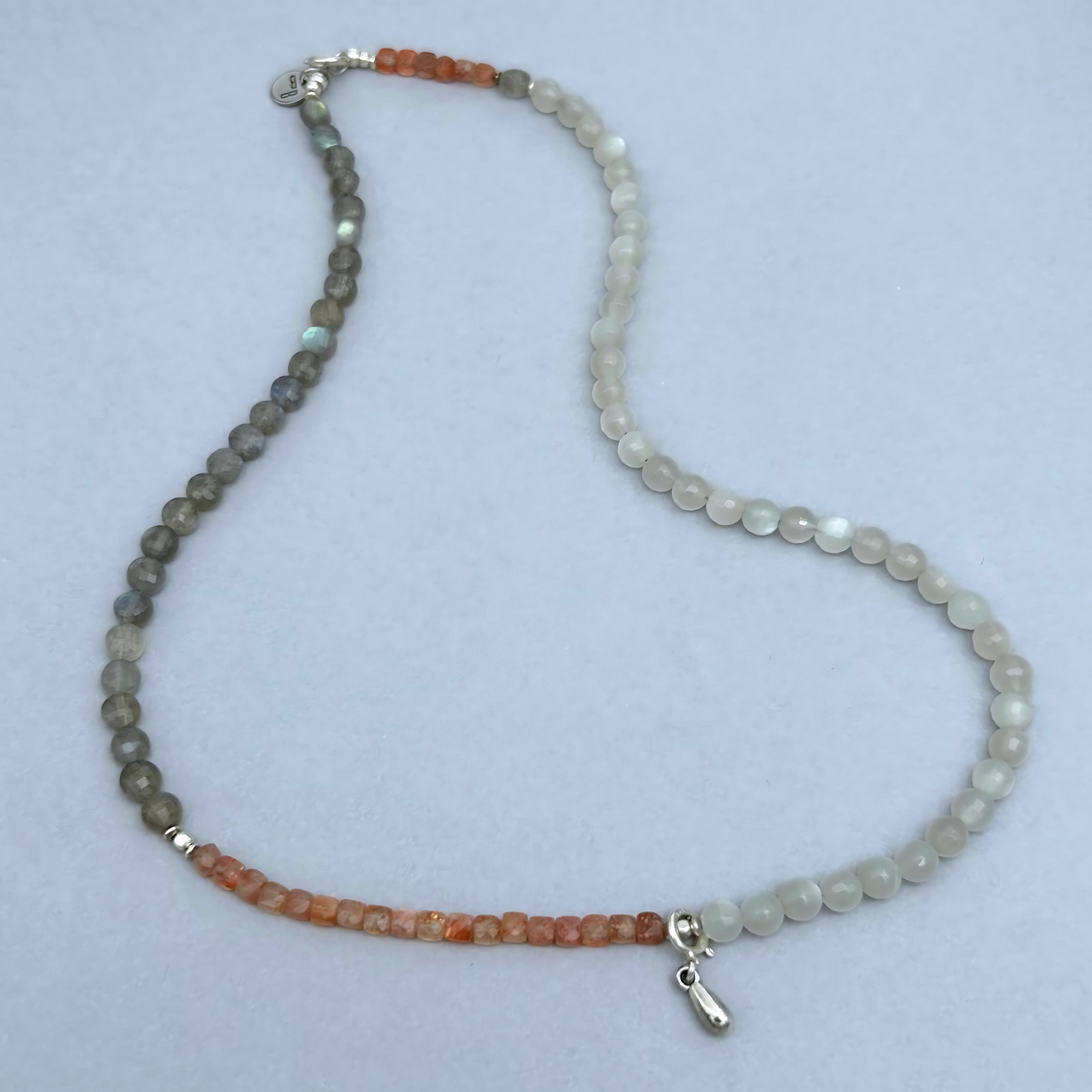 The soft feminine energy of Moonstones combined with the joyful vibes of Sunstone and the motivating powers of Labradorite gives this necklace a unique aura. 