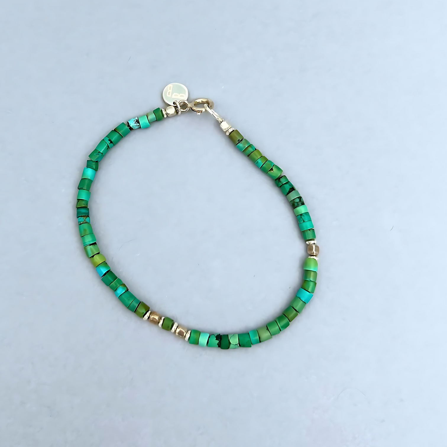 The Le BijouBijou Ocean Green Men's Bracelet is made with Blue-Green Turquoise and a touch of Sterling Silver.