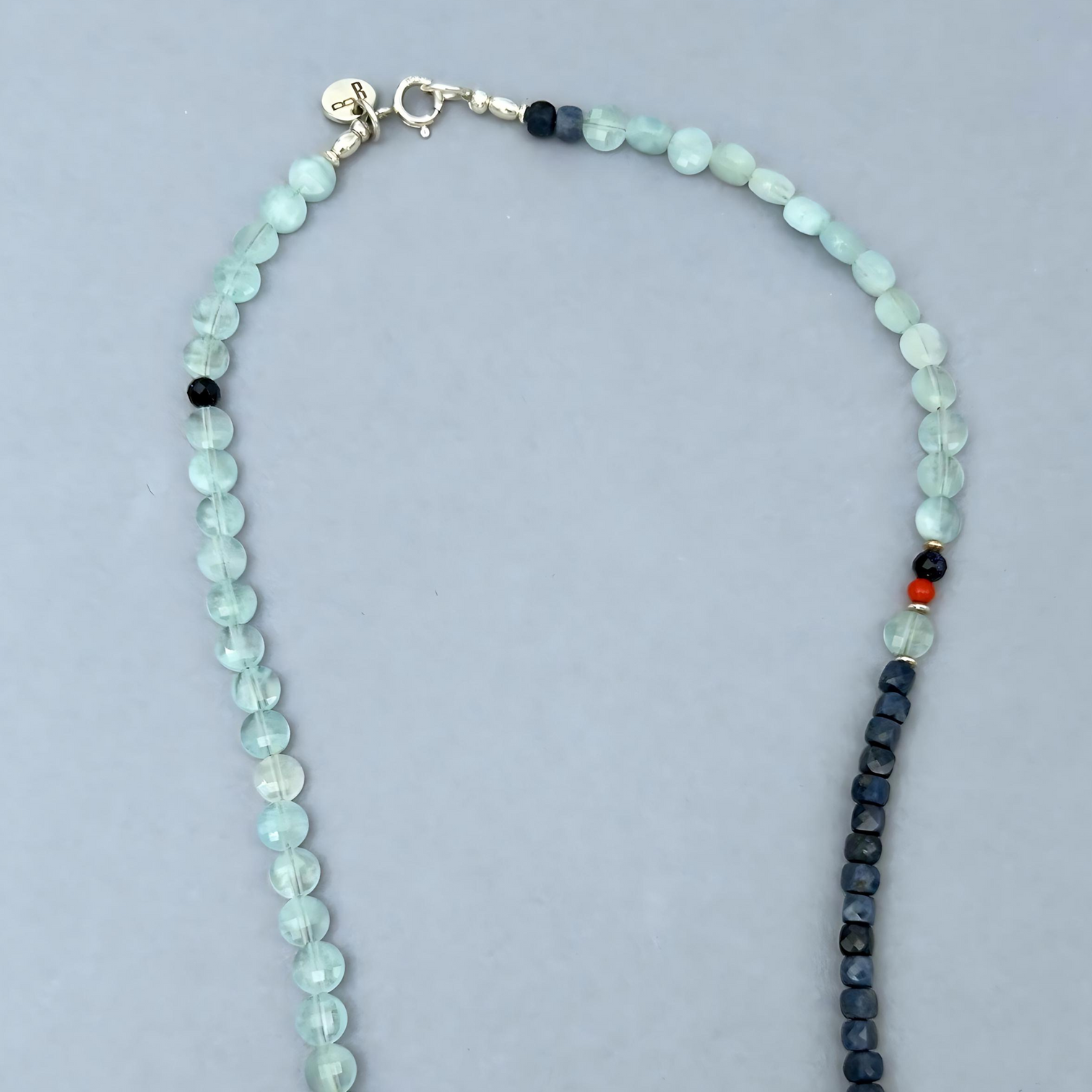 This LeBijouBijou Perfect Match Necklace is a made with a combination of aquamarines and sapphires. Detail Shot