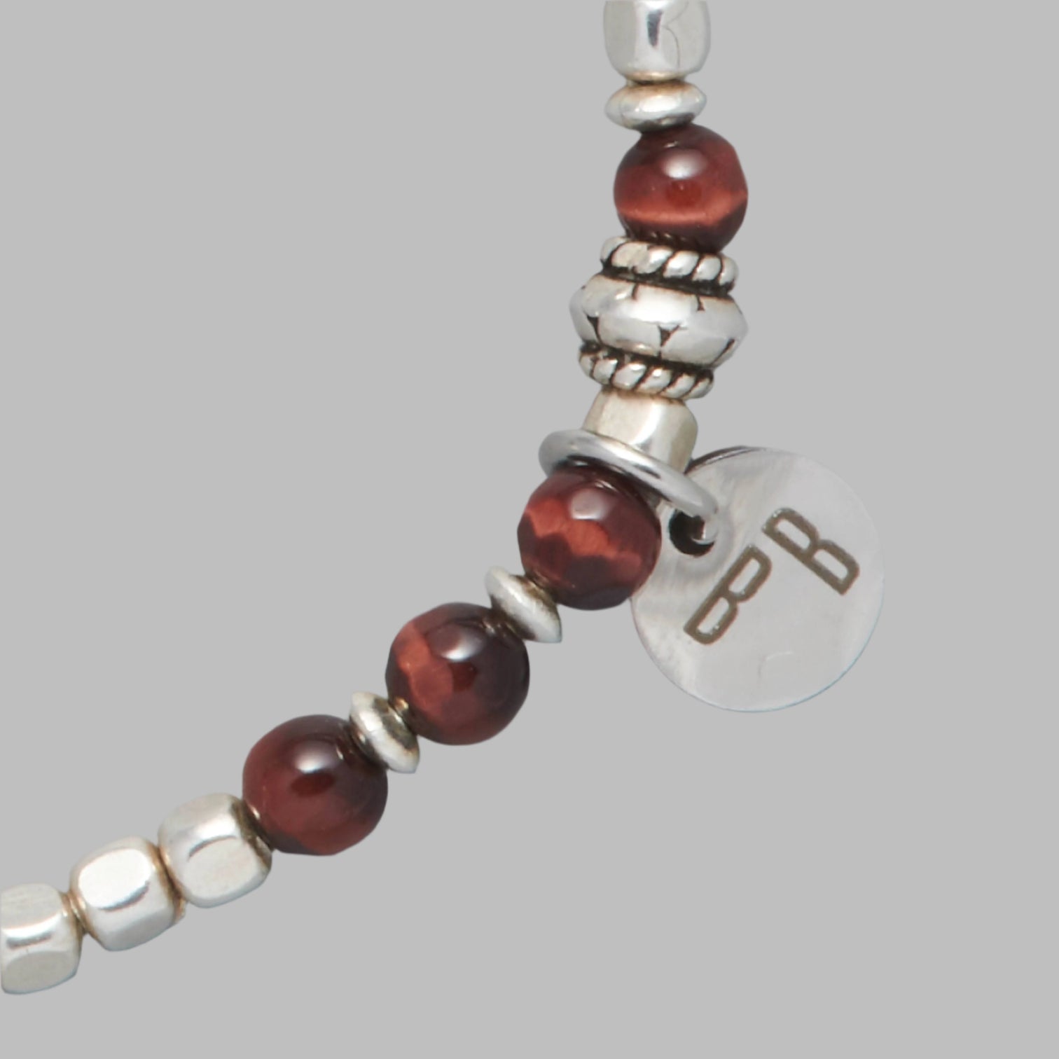 Close-up of ARIEL Men beaded bracelet made with Red Tiger Eyd and Sterling Silver Beachs and Elements