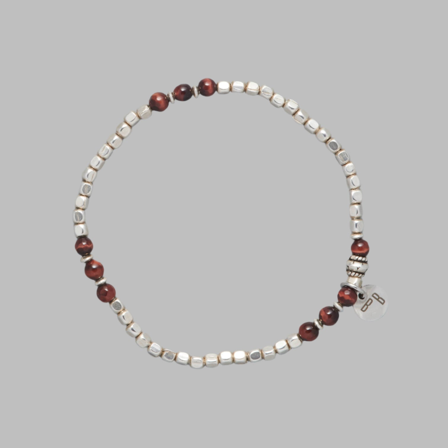 ARIEL is a men beaded bracelet made with Red Tiger Eye and Sterling Silver beads and elements. 