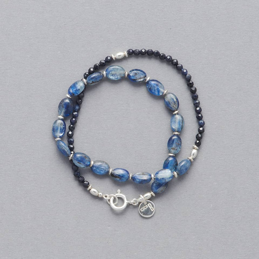 Product picture of the CIEL Double Wrap Bracelet made with oval-shaped Kyanite, faceted Sapphires and Sterling Silver.  