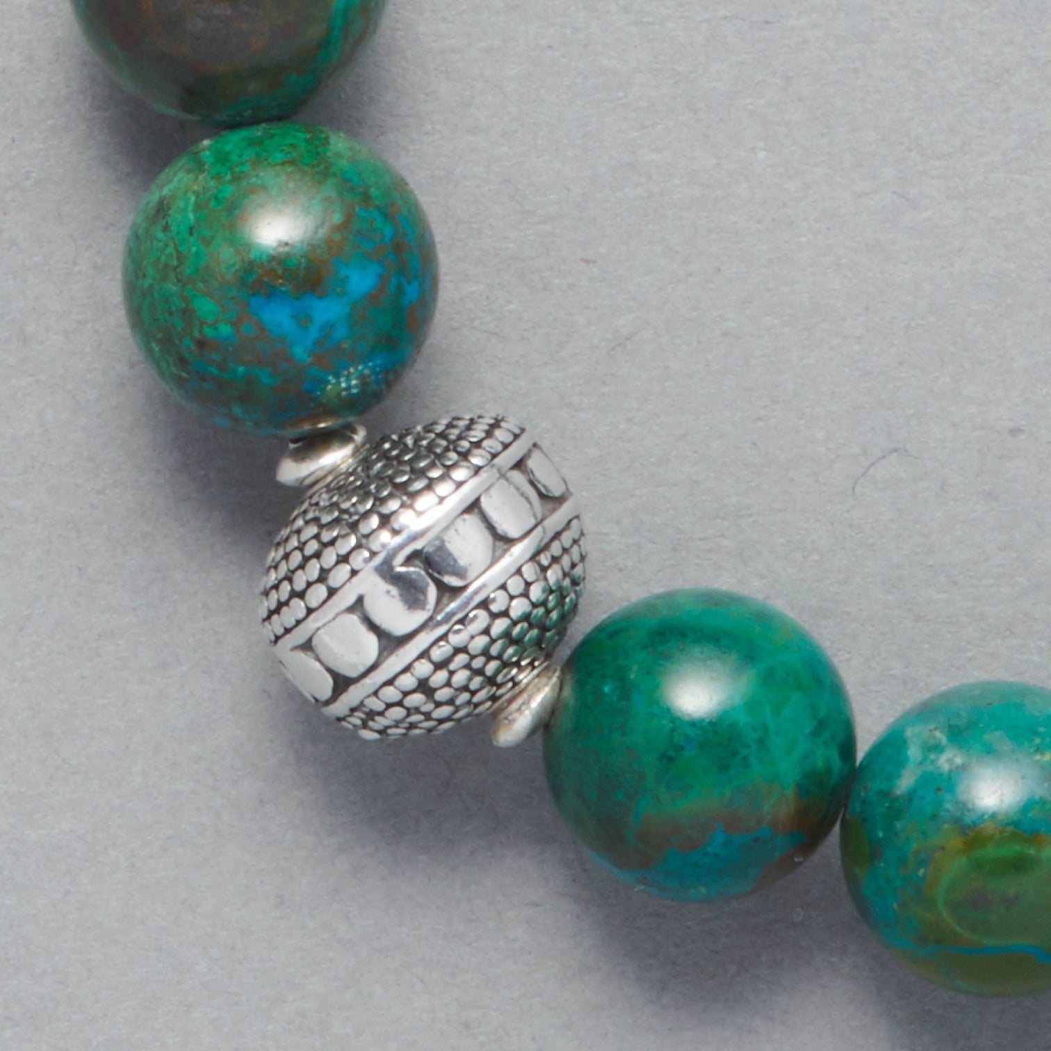 Detail of the Cyan Bracelet product shot, made with Chrysocolla and beautiful Sterling Silver Elements. 
