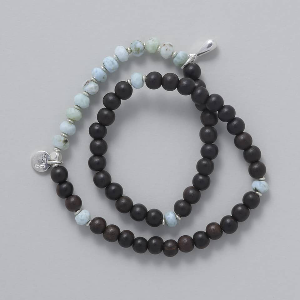 Product shot of the KAIA Double Wrap Bracelet made with Ebony Wood, Larimar and a touch of Sterling Silver