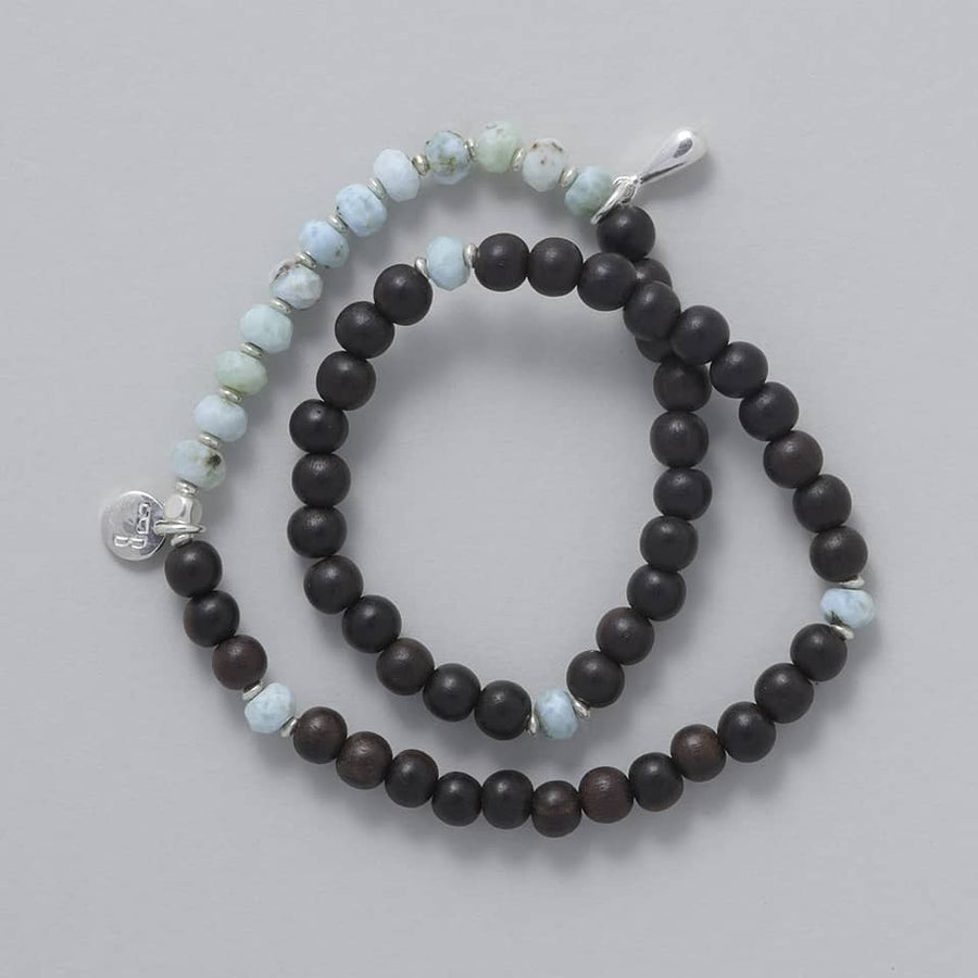 Product shot of the KAIA Double Wrap Bracelet made with Ebony Wood, Larimar and a touch of Sterling Silver
