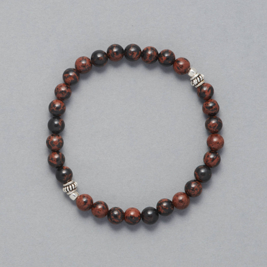 Product shot of the Kane Men Beaded Bracelet made with Mahogany Obsidian and Sterling Silver Elements. 