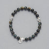 Product shot of the Laila Bracelet made with Falcon Eye and Sterling Silver Elements. 