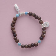 Product shot of the Le BijouBijou - My Little Feather Bracelet - made with Ebomy, Turquois and sterling silver.