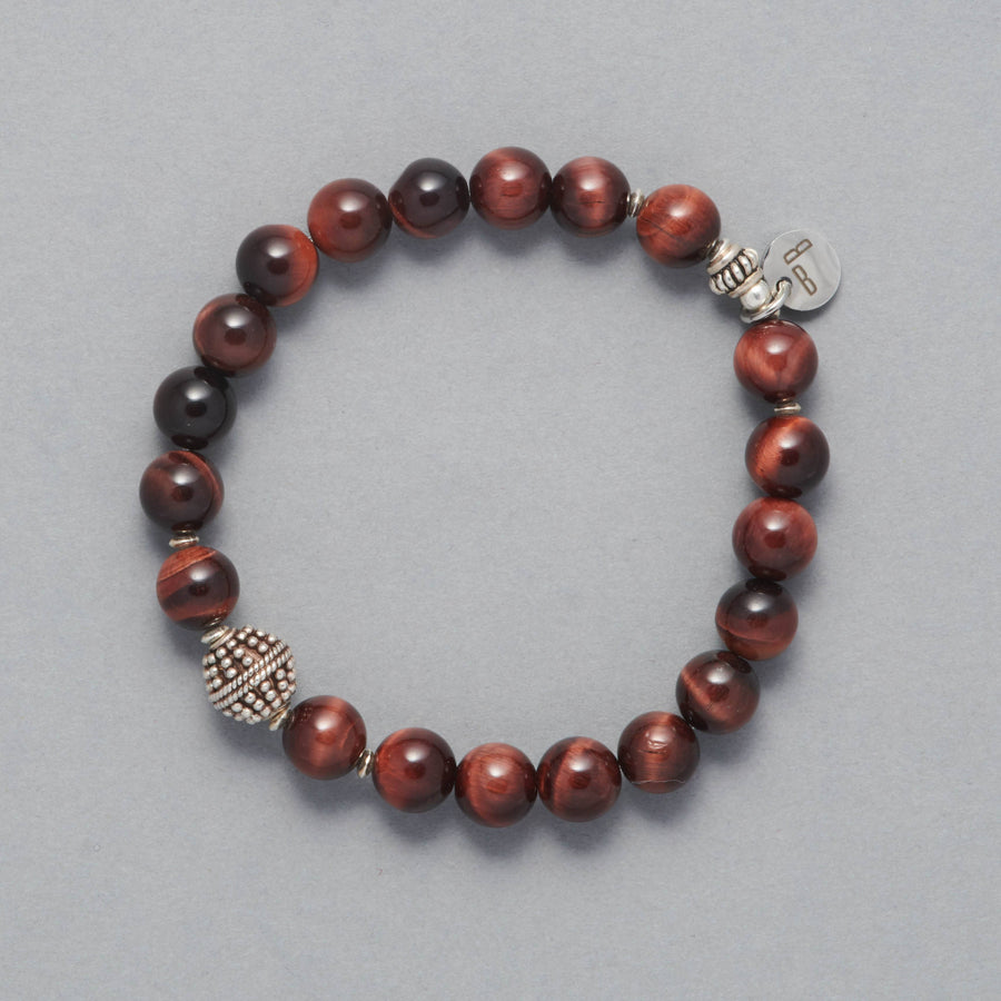 Product shot of the Phoenix Bracelet made with Red Tiger Eye and Sterling Silver Elements. 