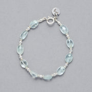 Product shot of the Zoe Bracelet made with oval-shaped Aquamarine and Sterling Silver elements. 