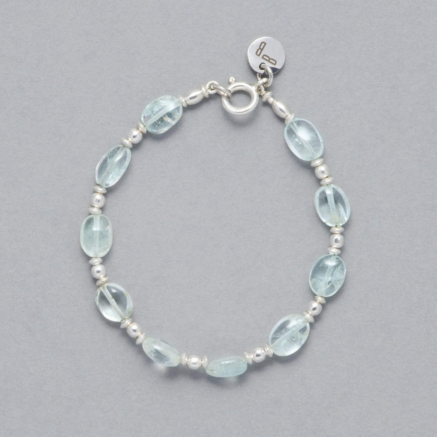 Product shot of the Zoe Bracelet made with oval-shaped Aquamarine and Sterling Silver elements. 
